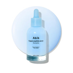 Abib bottle front view showing label and clear blue serum benefits