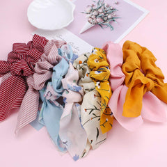 ACO-UINT scrunchie on bedside table in lifestyle scene suggesting everyday convenience