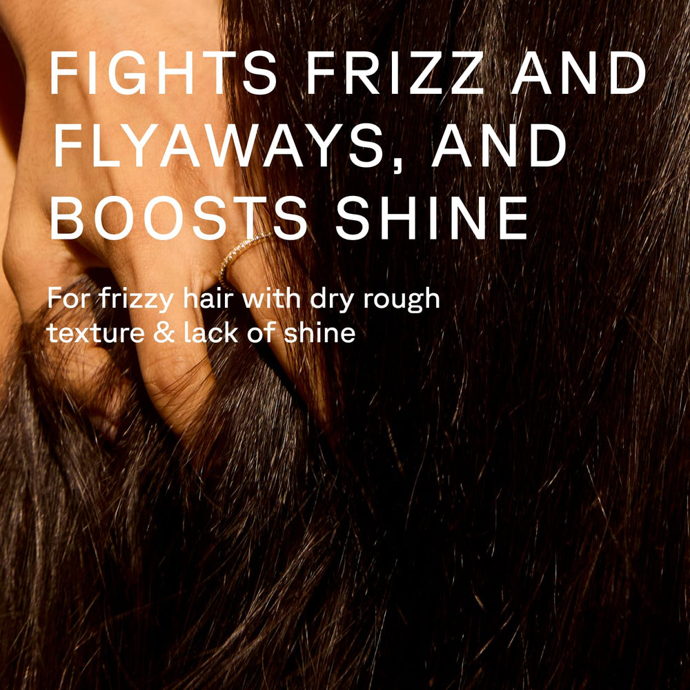 Acure creamy conditioner texture on palm showing smooth lightweight moisture benefit