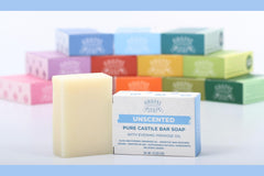Adams Handmade Soap bar next to a coin for scale indicating compact 4.5 oz size