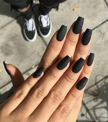 Aegenacess finished manicure close-up showing even matte coverage and refined coffin tips