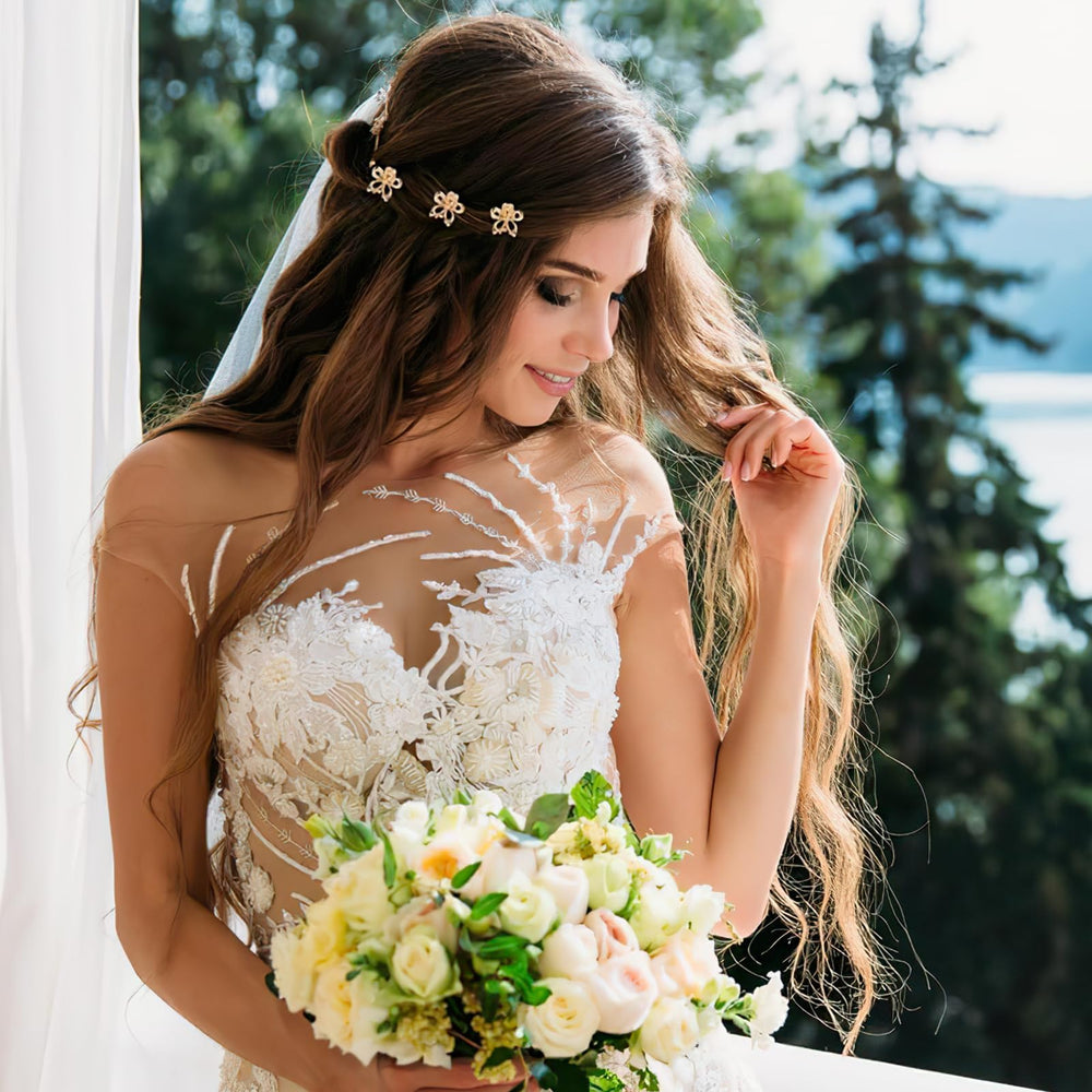 Aesnoun clips accenting a braid, adding decorative floral highlights