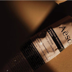 Aesop hand applying balm showing fast absorption and nourishment