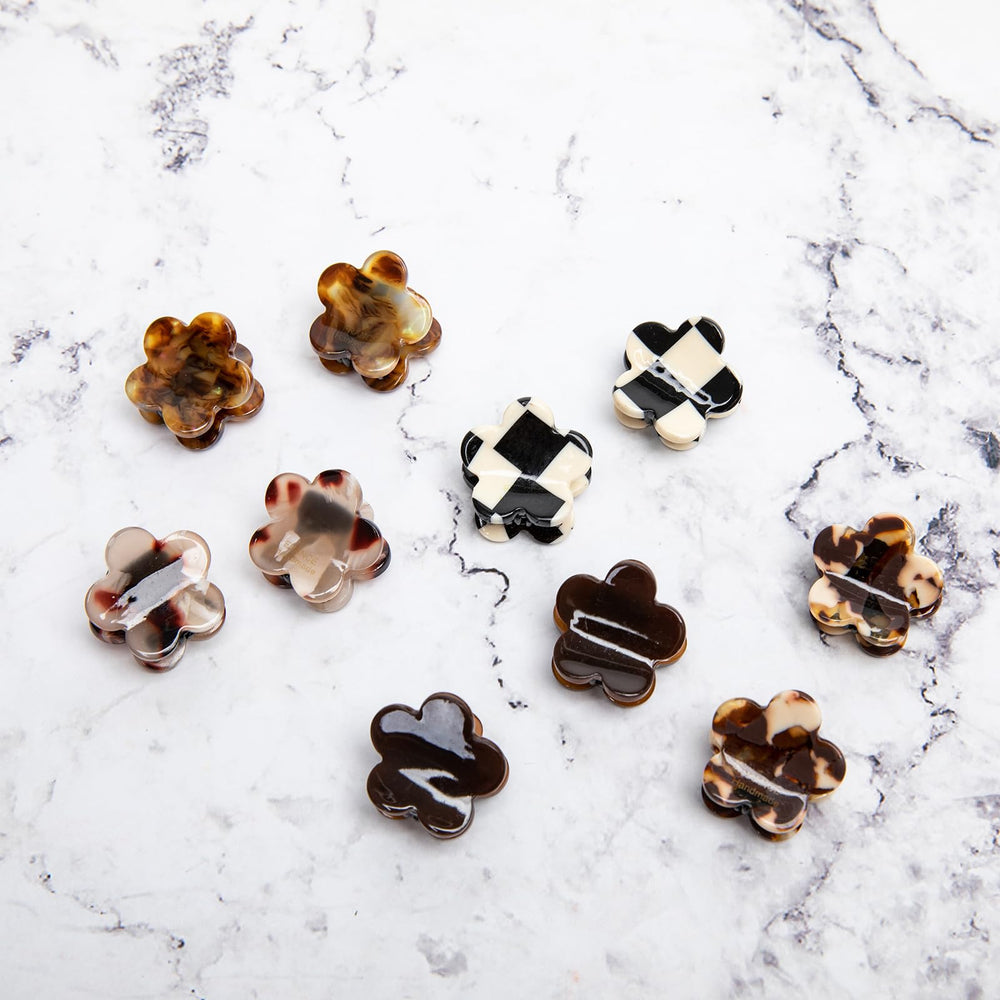 Agirlvct clips next to a coin for scale, shows compact 2x2 cm size benefit
