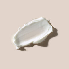 AHAVA cream being smoothed on cheek demonstrating nourishing application and comfort