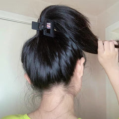 AHONEY clip securing thick hair demonstrating strong hold without breakage