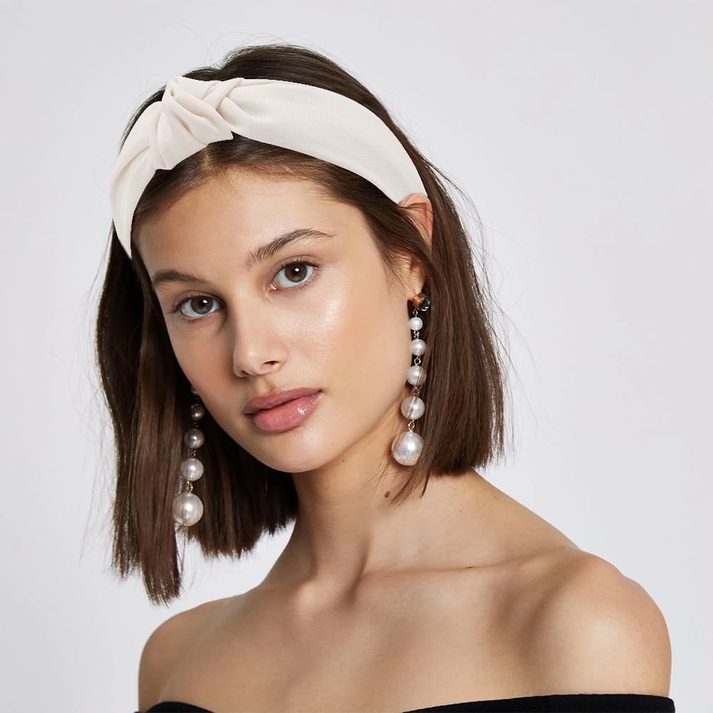 AHONEY flatlay of five headbands demonstrating mix of neutral styles
