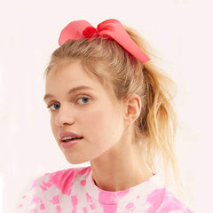 Aileam scrunchie securing a ponytail in dark green, showing strong hold