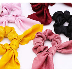 Aileam scrunchie next to coin to show compact size and travel convenience