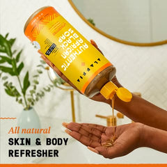 Alaffia pouring liquid texture highlighting moisturizing shea content