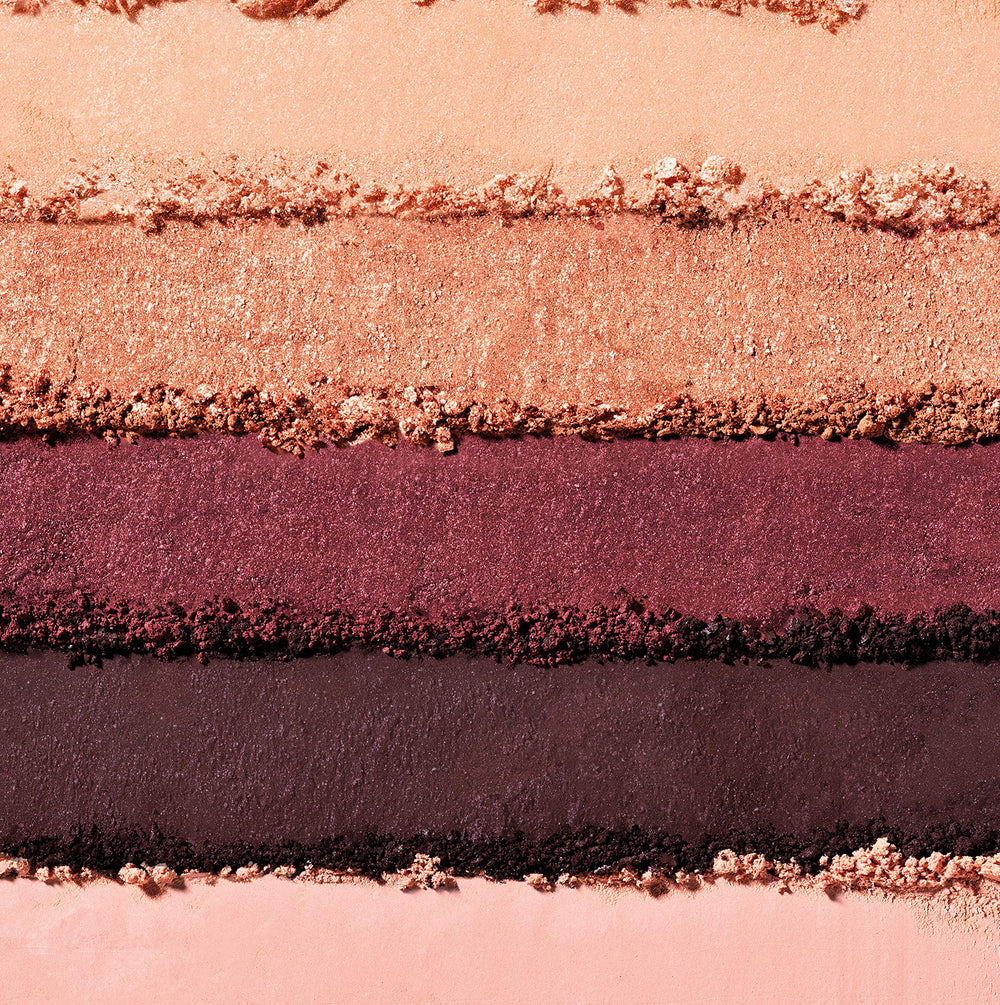 Almay primer pan closeup highlighting vitamin E base — smoother application benefit