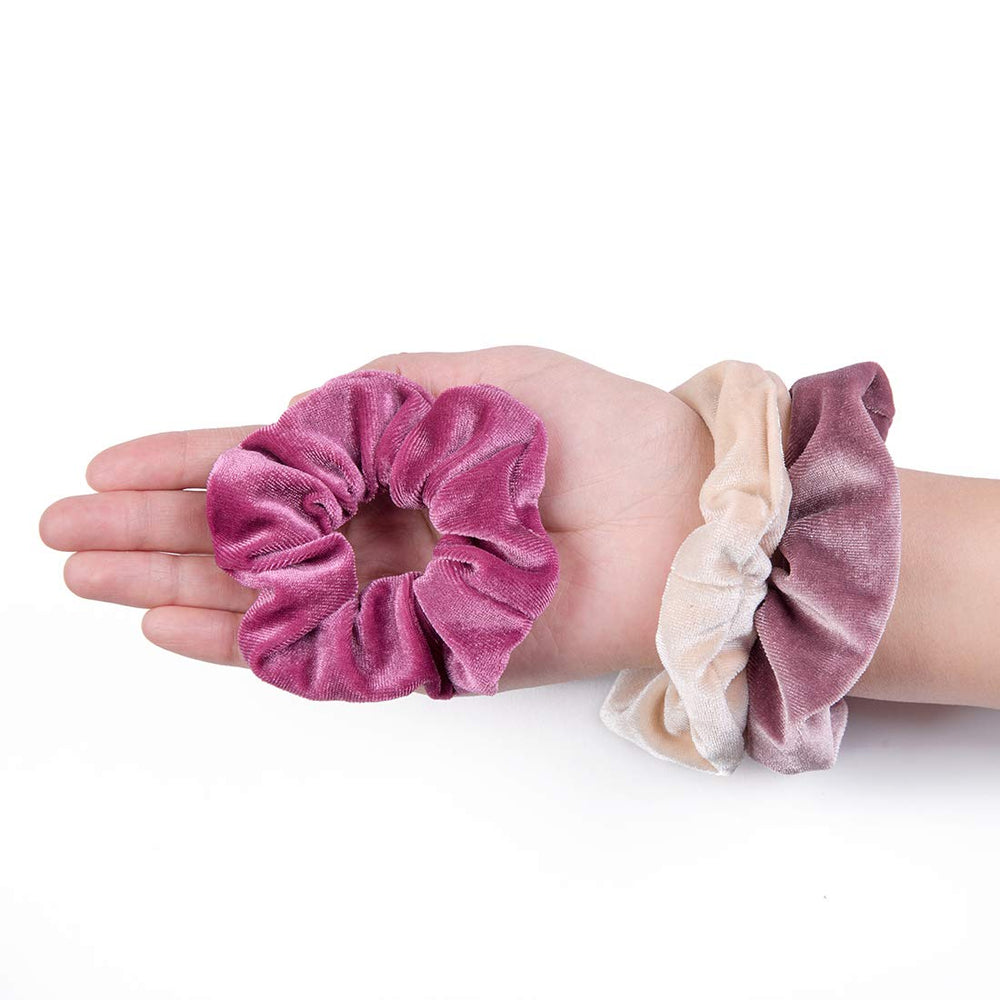 ALMHH scrunchies held in hand to show size and stretch for convenience
