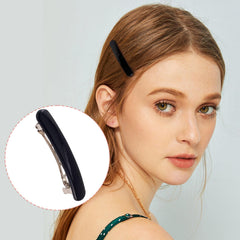 Alpinleux barrette next to hand for scale showing 2.48-inch size benefit