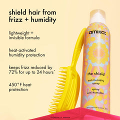 amika the shield spray held in hand demonstrating heat protection
