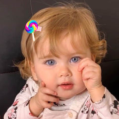 AMMY child wearing mixed barrettes demonstrating secure hold and playful look