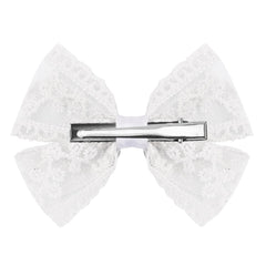 Amybasic bow clip worn in a child’s hair showing secure hold and pretty accent