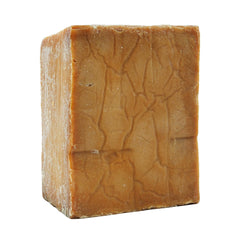 Anatolia Soap large bar beside a coin for scale showing value and long-lasting size