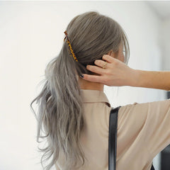 ANBALA clip in hand to show size and ergonomic curve for comfortable fit