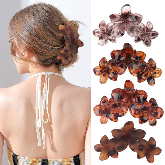 ANBALA front view of four plumeria clips showing colors and shape, for styling variety