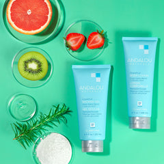 Andalou Naturals bottle next to hand for scale and easy travel-friendly size