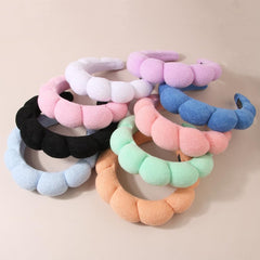 AOENJIE headband side profile on model demonstrating stable, non-slip fit