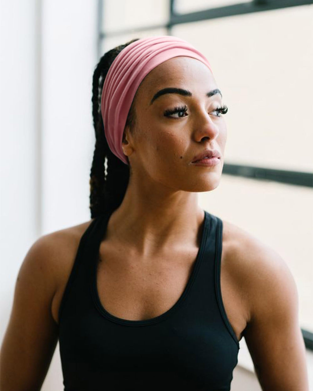 AQOKKA headband worn during yoga showing sweat absorption and secure fit for activity
