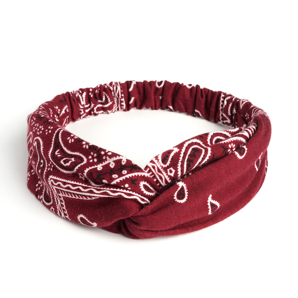 AQOKKA headband held in hand to show width and stretch for comfortable fit