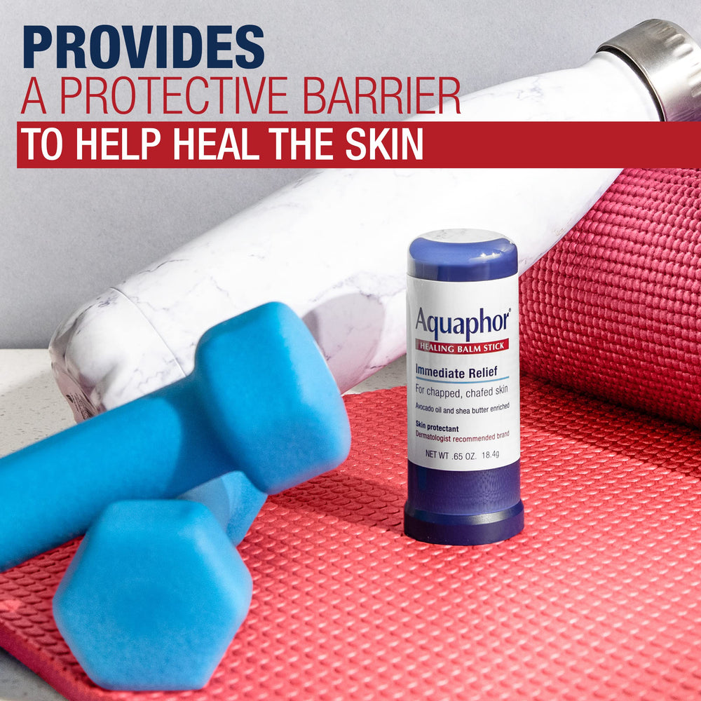 Hand holding Aquaphor stick to show compact 0.65 oz scale and easy carry benefit