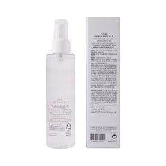 Ariul bottle on a vanity styled with plants showing daily routine benefit