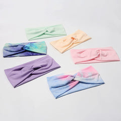 Artilady flatlay of six colorful headwraps showing styling and color coordination