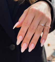 Artquee close-up of pink white ombre gradient glossy finish, highlights smooth salon-quality shine