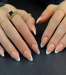 Artquee close-up of glossy white French tip highlighting clean finish