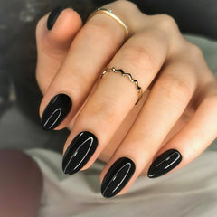 Artquee front packaging showing 30 black almond press-on nails and contents for easy application