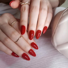 Artquee close-up of red almond nail shine highlighting salon-quality gloss