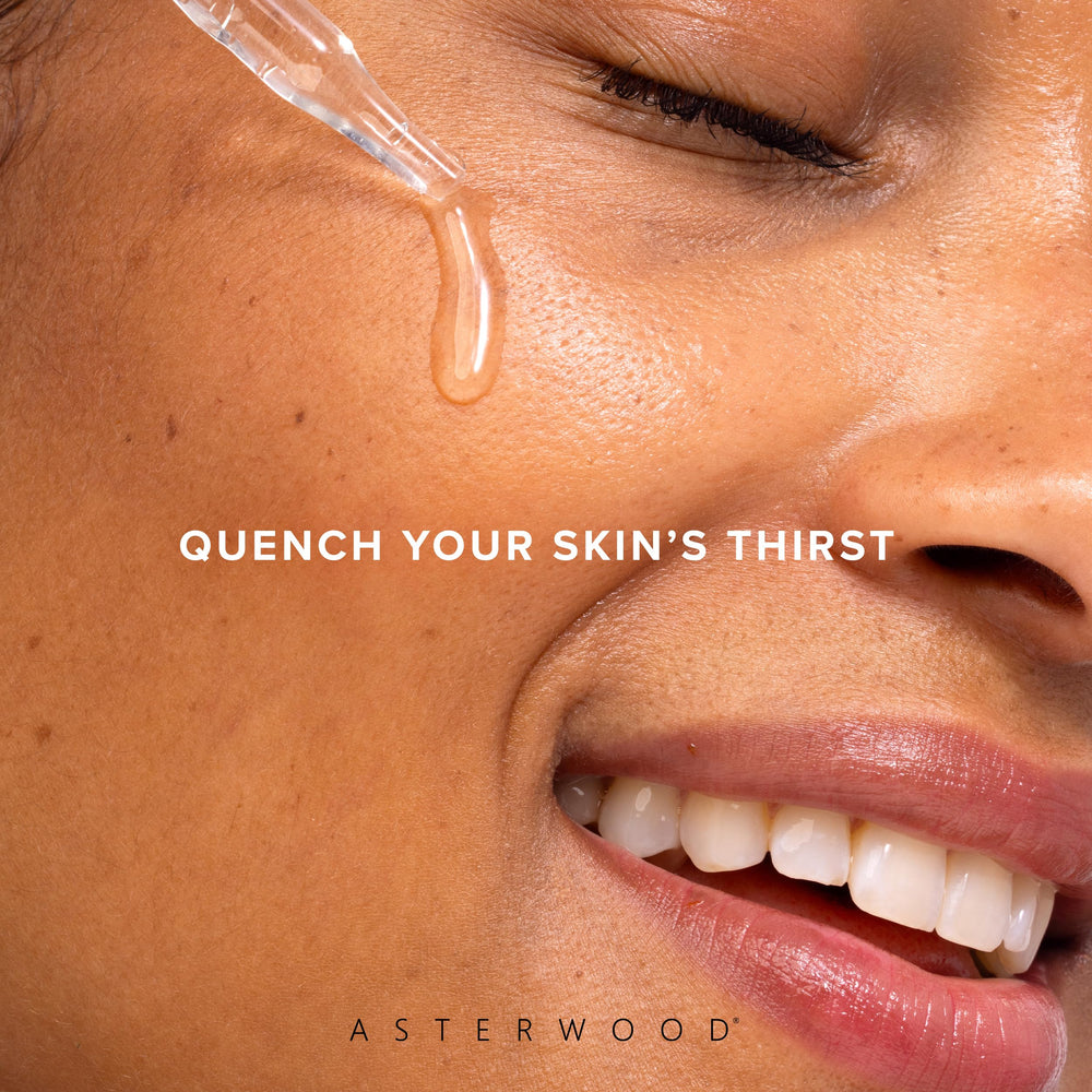 Model applying Asterwood serum to face, illustrates easy layering and moisturized look