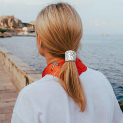 Aswewamt styled at event on model adding metallic accent to formal hairstyle