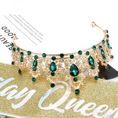 Atoden packaging and accessories showing crown, sash, and included safety pin