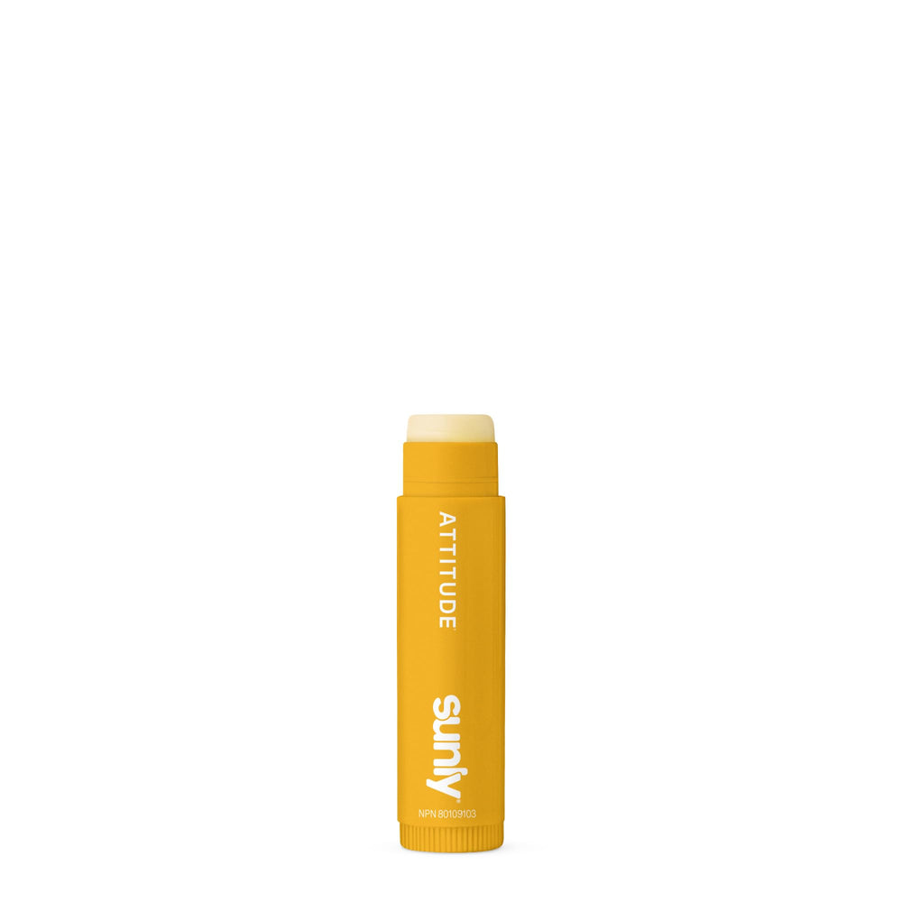 ATTITUDE lip balms inside a purse for travel-ready daily protection
