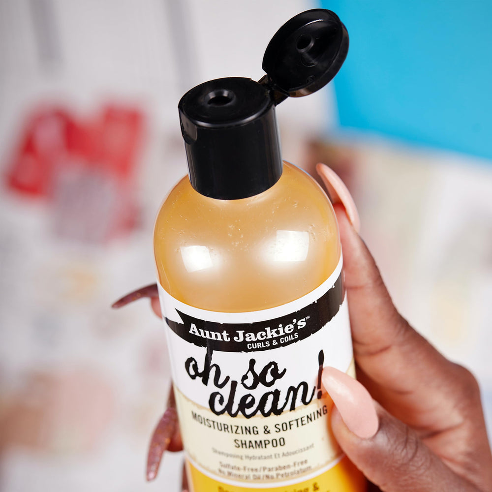 Aunt Jackie's bottle beside model with defined curls showing improved manageability
