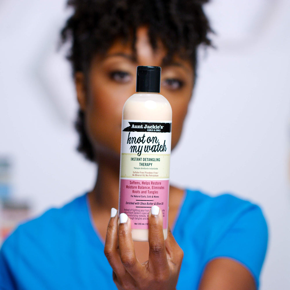 Aunt Jackie's spray application on curly hair demonstrating easier combing and slip