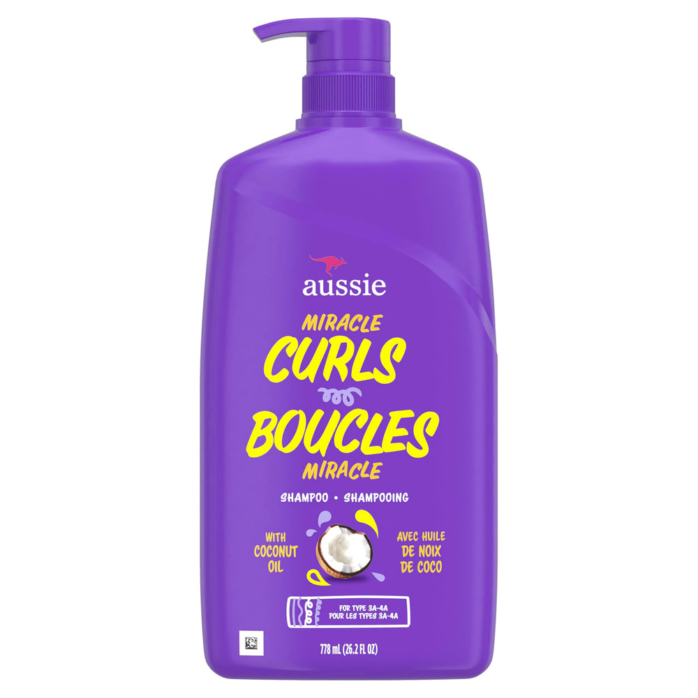 Aussie bottle held in hand illustrating the 26.2 fl oz size
