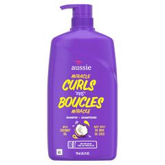 Aussie bottle held in hand illustrating the 26.2 fl oz size