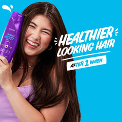 Aussie shampoo texture on palm demonstrating creamy, hydrating lather