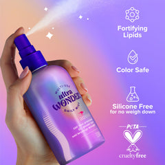 Aussie Ultra Wonder being sprayed on damp hair to detangle and protect