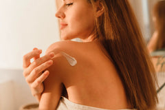 Australian Gold being applied to forearm demonstrating soothing hydration benefit