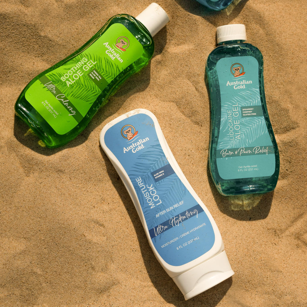 Australian Gold bottle in hand for size scale and travel-friendly benefit