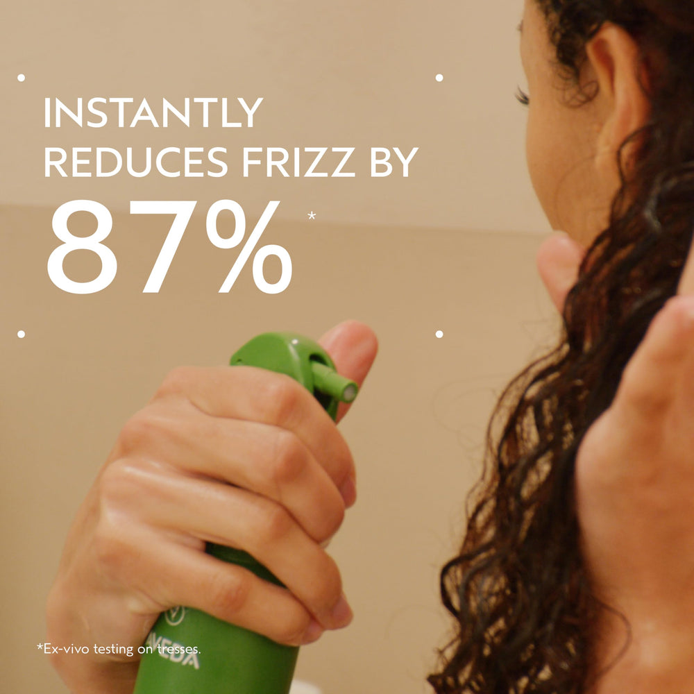 Aveda Be Curly spray nozzle close-up demonstrating fine mist for even application