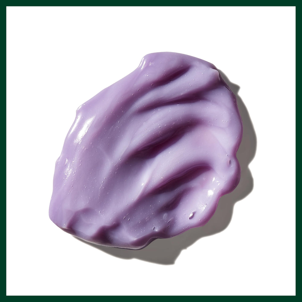 Aveda Blue Malva being applied to wet hair in shower demonstrating toning and conditioning benefit