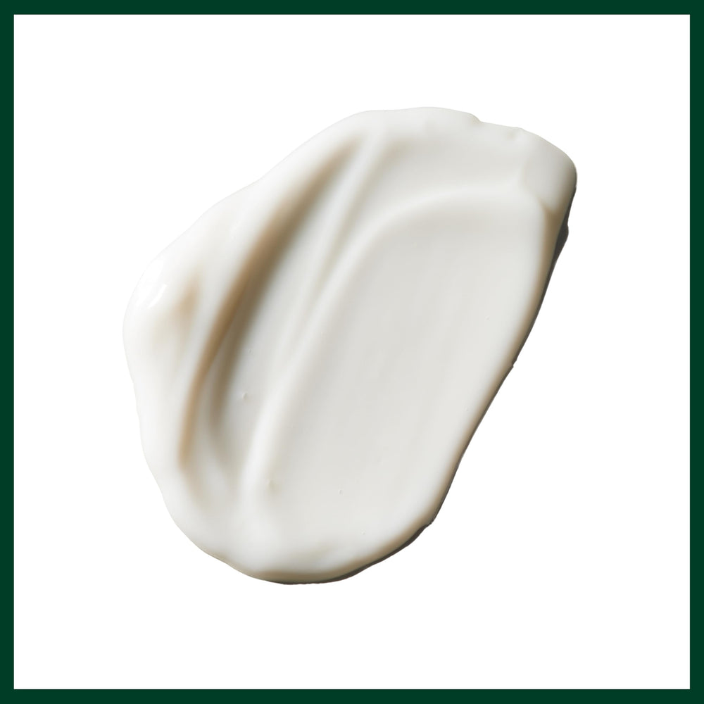 Aveda lotion spread on hand, demonstrates fast absorption and non-greasy feel