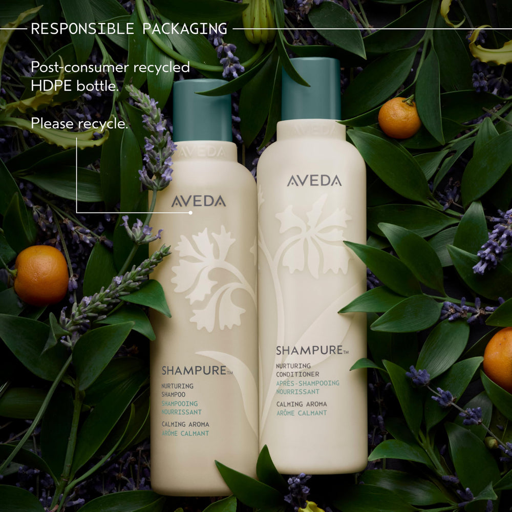 Aveda Shampure tucked into a travel bag ready for on-the-go hair care convenience